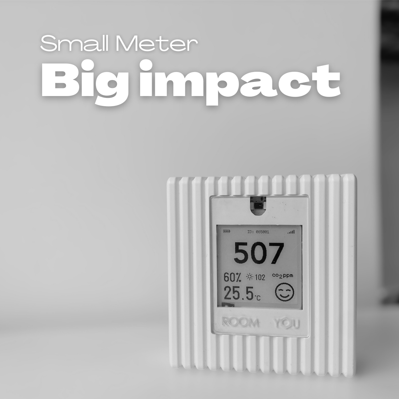 Digital CO2 meter display mounted on office wall showing real-time air quality readings
